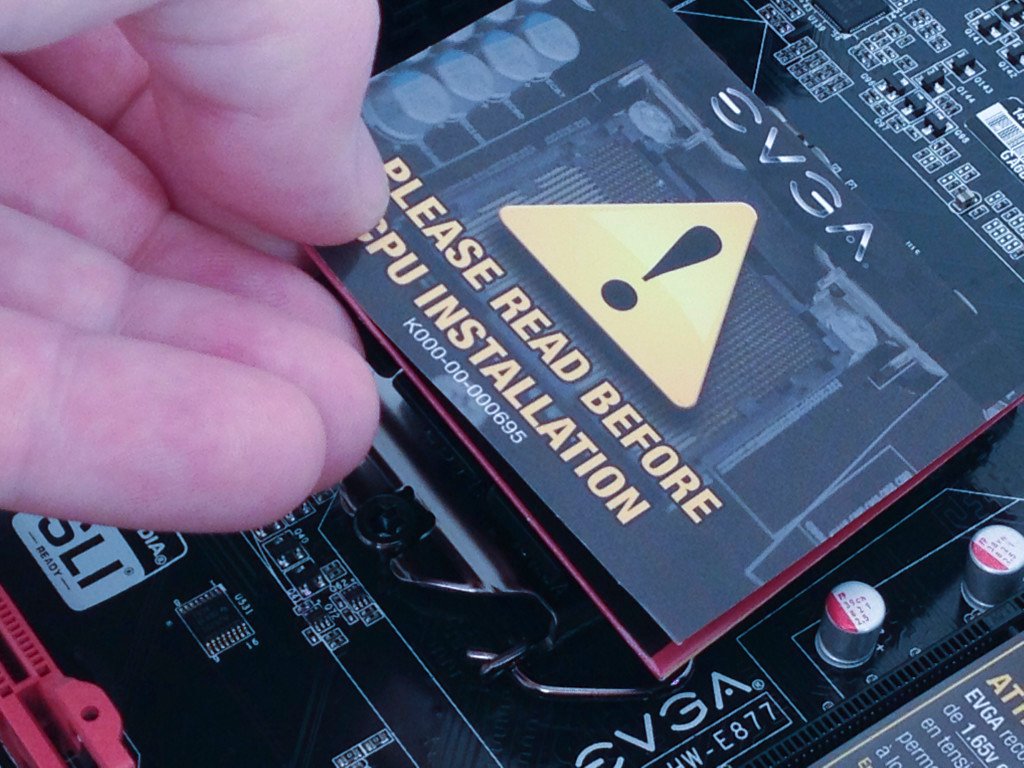 Plastic CPU socket cover removal.